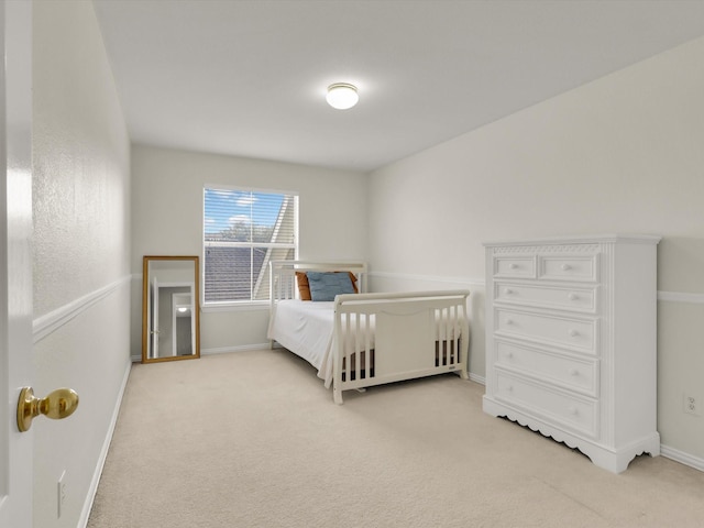 bedroom with light colored carpet