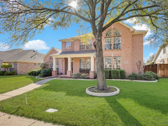 view of front of property featuring a porch and a front yard