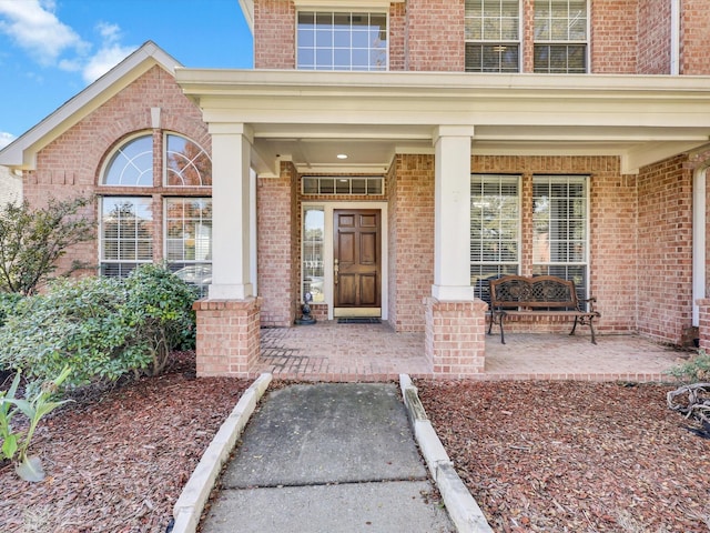 property entrance featuring covered porch