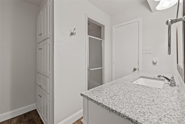 bathroom with vanity and an enclosed shower