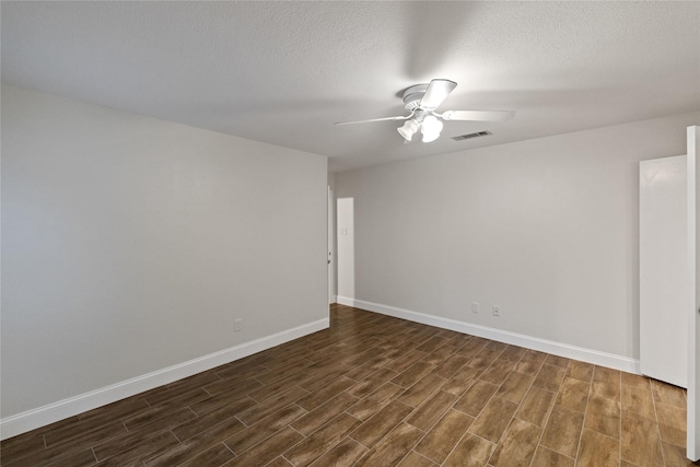 spare room featuring ceiling fan and a textured ceiling