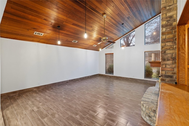 spare room with a high ceiling, plenty of natural light, ceiling fan, and wood ceiling