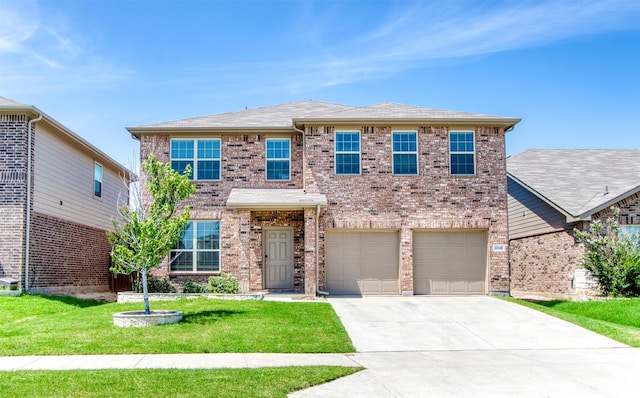 view of front of house with a garage and a front yard