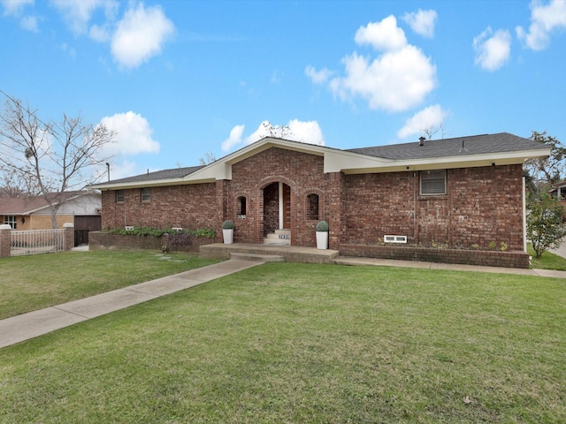 ranch-style house featuring a front lawn