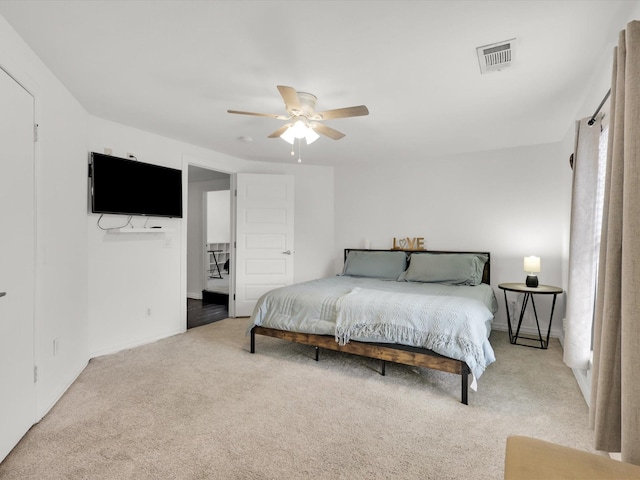 carpeted bedroom featuring ceiling fan