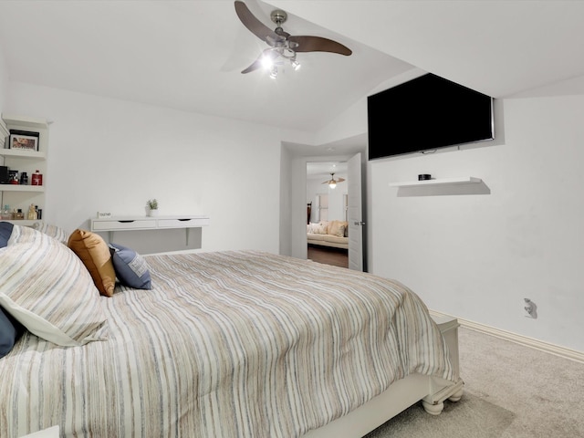 carpeted bedroom with ceiling fan and vaulted ceiling