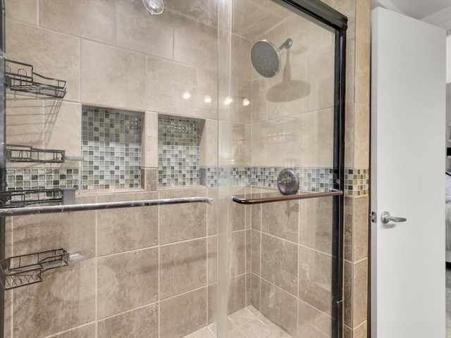 bathroom with a shower with shower door