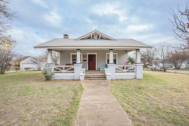 bungalow-style home featuring a porch and a front lawn