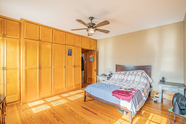 bedroom featuring ceiling fan and light wood-type flooring