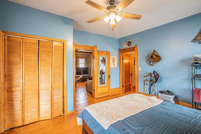 bedroom featuring light hardwood / wood-style flooring, a closet, and ceiling fan