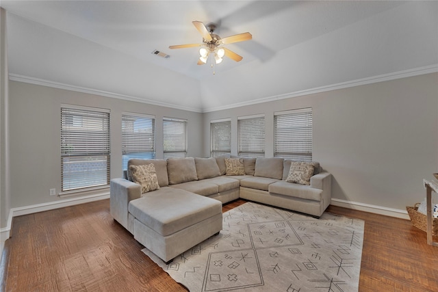 living room featuring ceiling fan, vaulted ceiling, ornamental molding, and light hardwood / wood-style flooring