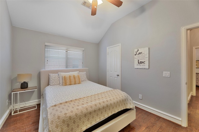 bedroom with ceiling fan, dark hardwood / wood-style flooring, and lofted ceiling