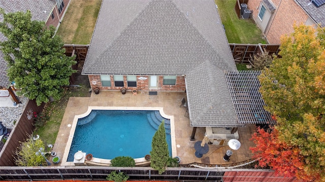 view of swimming pool featuring central AC unit