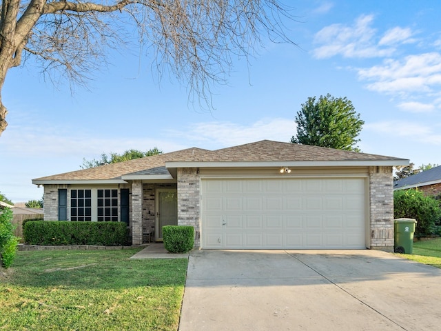 single story home with a front yard and a garage