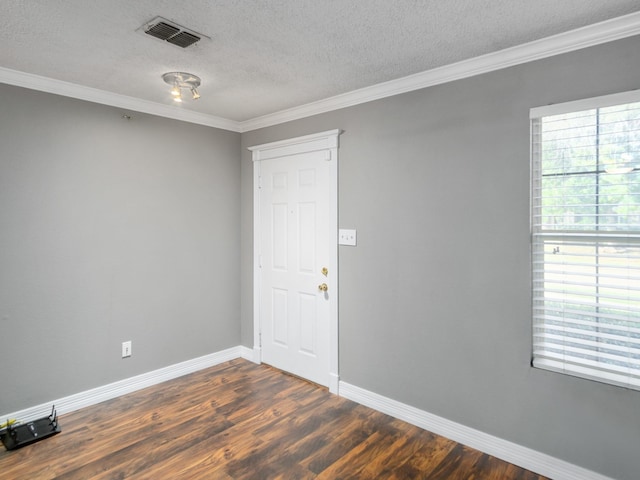 unfurnished room featuring a textured ceiling, crown molding, and dark hardwood / wood-style floors