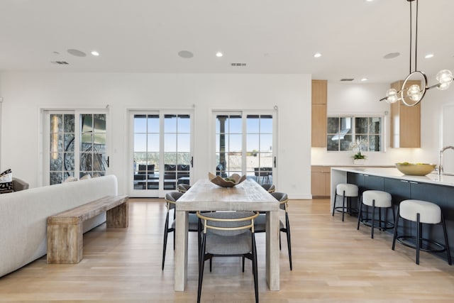 dining room featuring light hardwood / wood-style flooring