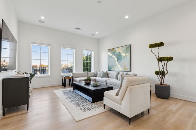 living room with light hardwood / wood-style floors