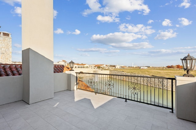 view of patio featuring a balcony