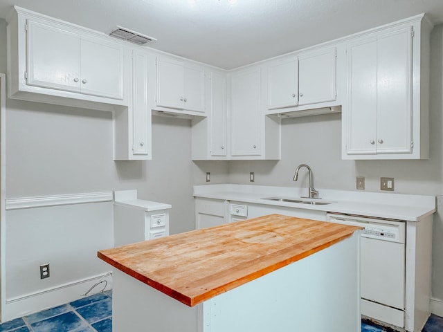 kitchen featuring a center island, white dishwasher, white cabinetry, and sink