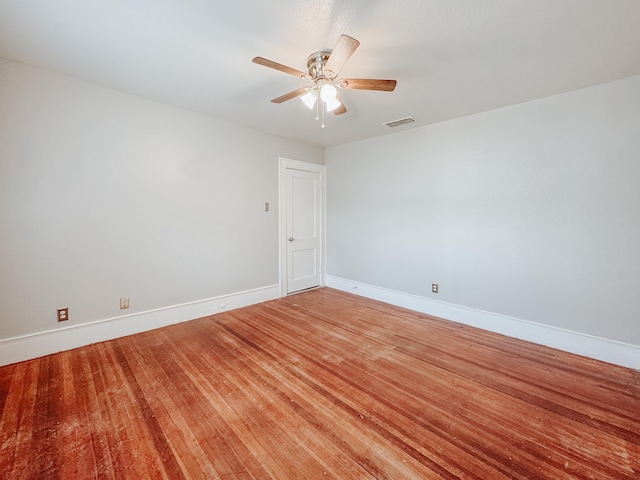 empty room featuring wood-type flooring and ceiling fan