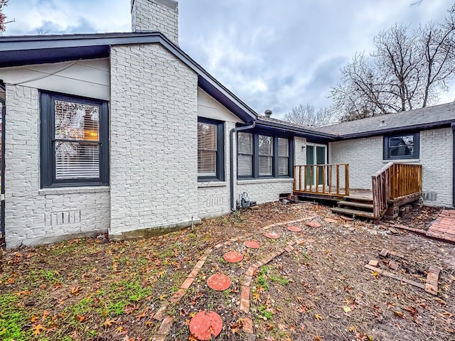 view of property exterior featuring a deck