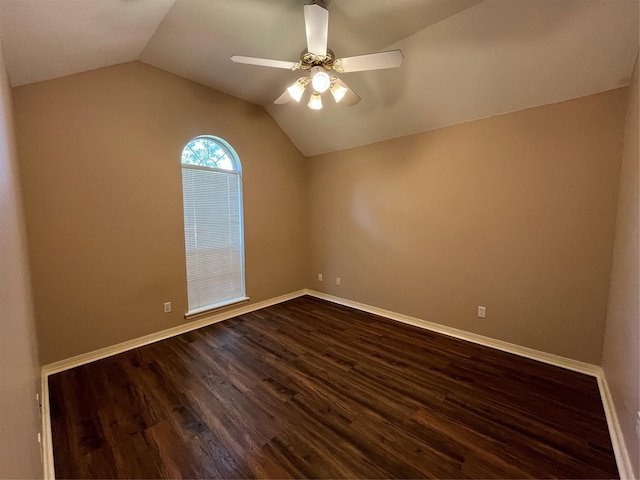 spare room with ceiling fan, dark hardwood / wood-style flooring, and lofted ceiling