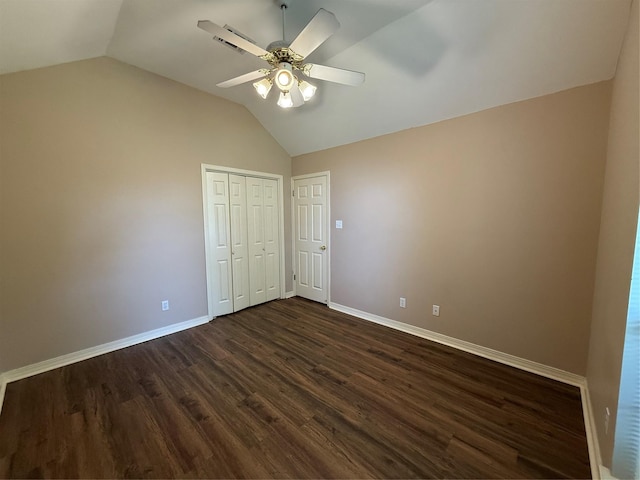 6420 Sand Hill Ave, Shreveport, LA 71107 - unfurnished bedroom with vaulted ceiling, baseboards, dark wood-type flooring, a closet, and a ceiling fan