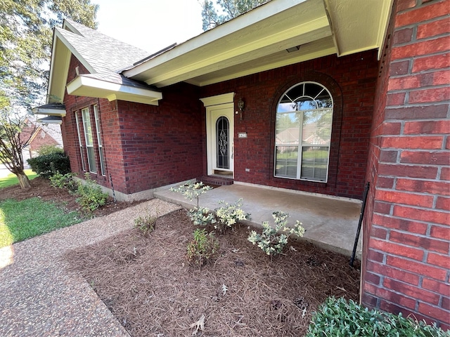 property entrance with covered porch