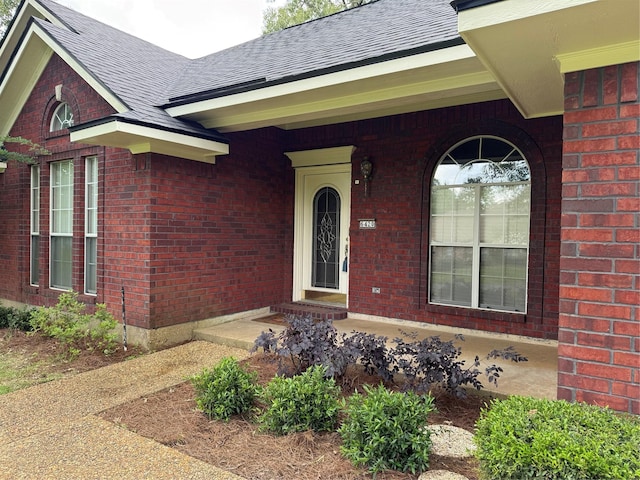 6420 Sand Hill Ave, Shreveport, LA 71107 - property entrance featuring a shingled roof and brick siding