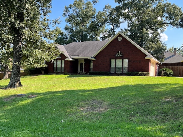 ranch-style home with a front lawn