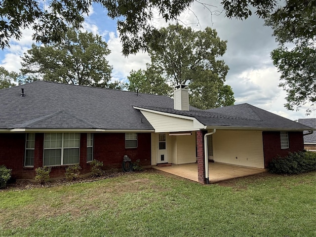 6420 Sand Hill Ave, Shreveport, LA 71107 - back of house with a patio, a yard, a chimney, and brick siding
