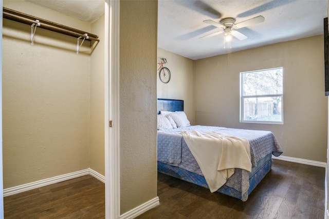 bedroom featuring a closet, ceiling fan, and dark hardwood / wood-style flooring