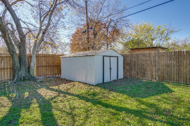 view of outbuilding featuring a lawn