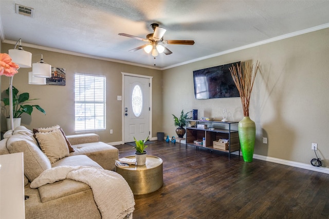 living room with crown molding, dark hardwood / wood-style flooring, ceiling fan, and a textured ceiling