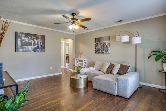 living room with ceiling fan, dark hardwood / wood-style flooring, and ornamental molding