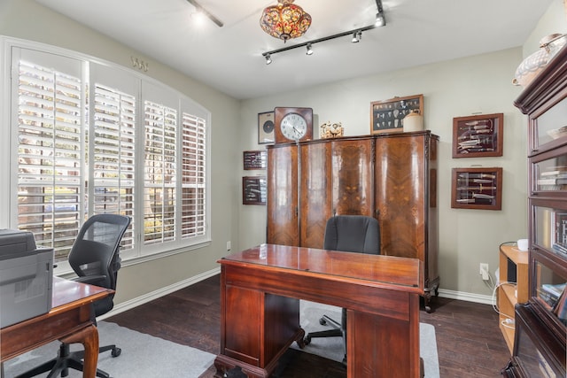 office area featuring dark hardwood / wood-style flooring and rail lighting