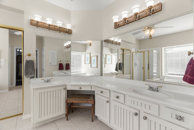 bathroom with tile patterned floors, plenty of natural light, ceiling fan, and an enclosed shower