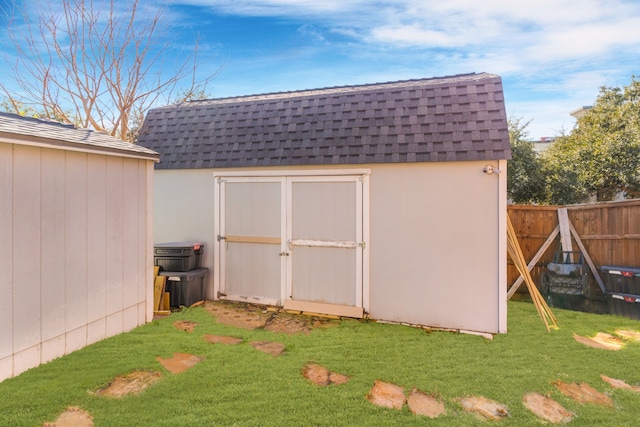 view of outdoor structure with a lawn