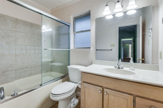 full bathroom with toilet, vanity, bath / shower combo with glass door, and ornamental molding