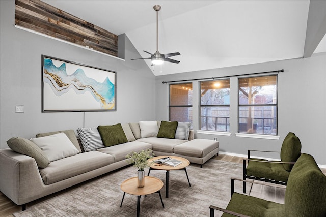 living room with ceiling fan, hardwood / wood-style floors, and lofted ceiling