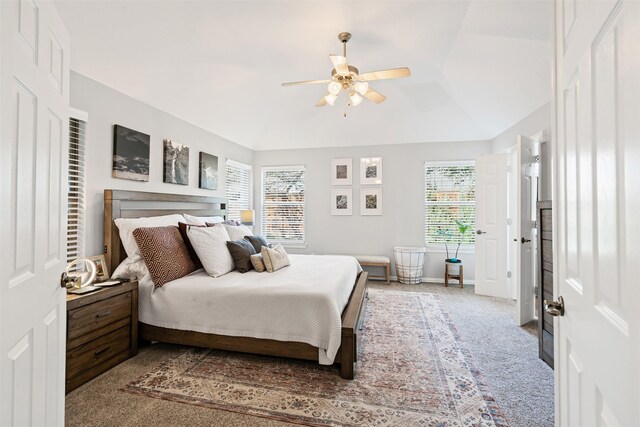 carpeted bedroom featuring ceiling fan and lofted ceiling