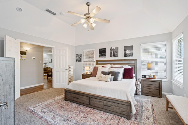 carpeted bedroom featuring ceiling fan and lofted ceiling