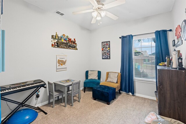 interior space featuring ceiling fan and light colored carpet