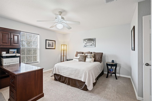 bedroom featuring ceiling fan and light colored carpet