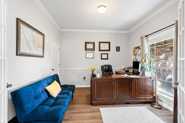 office space featuring light wood-type flooring and ornamental molding