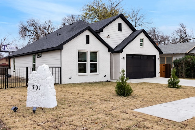 modern inspired farmhouse with a garage and a front yard