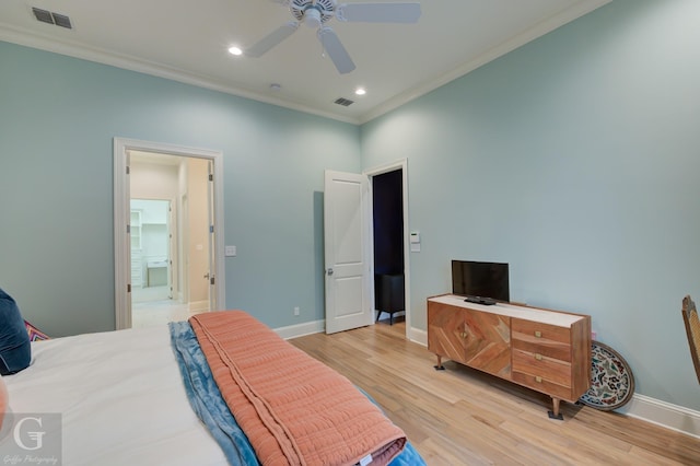 bedroom featuring ceiling fan, ensuite bath, ornamental molding, and light wood-type flooring