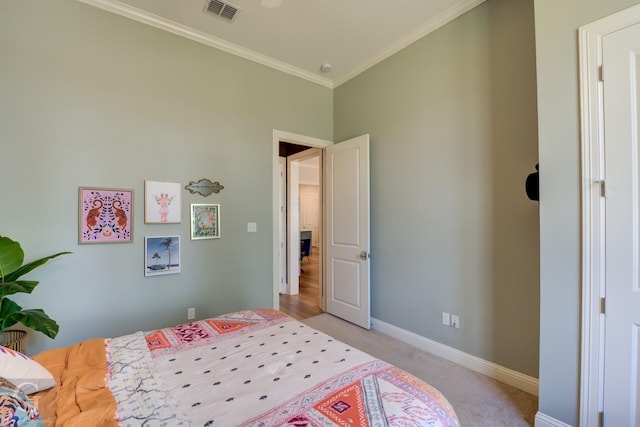 carpeted bedroom with crown molding