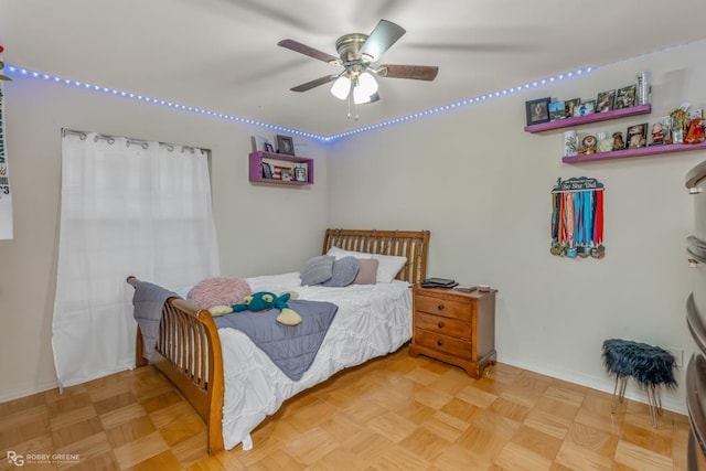 bedroom with parquet flooring and ceiling fan