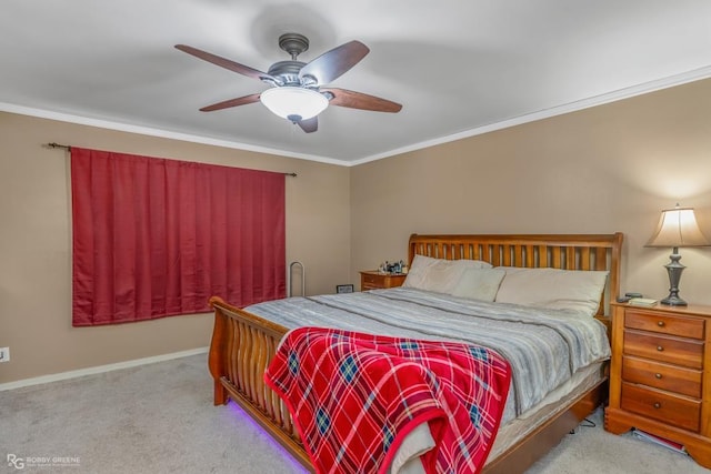 carpeted bedroom featuring ceiling fan and ornamental molding